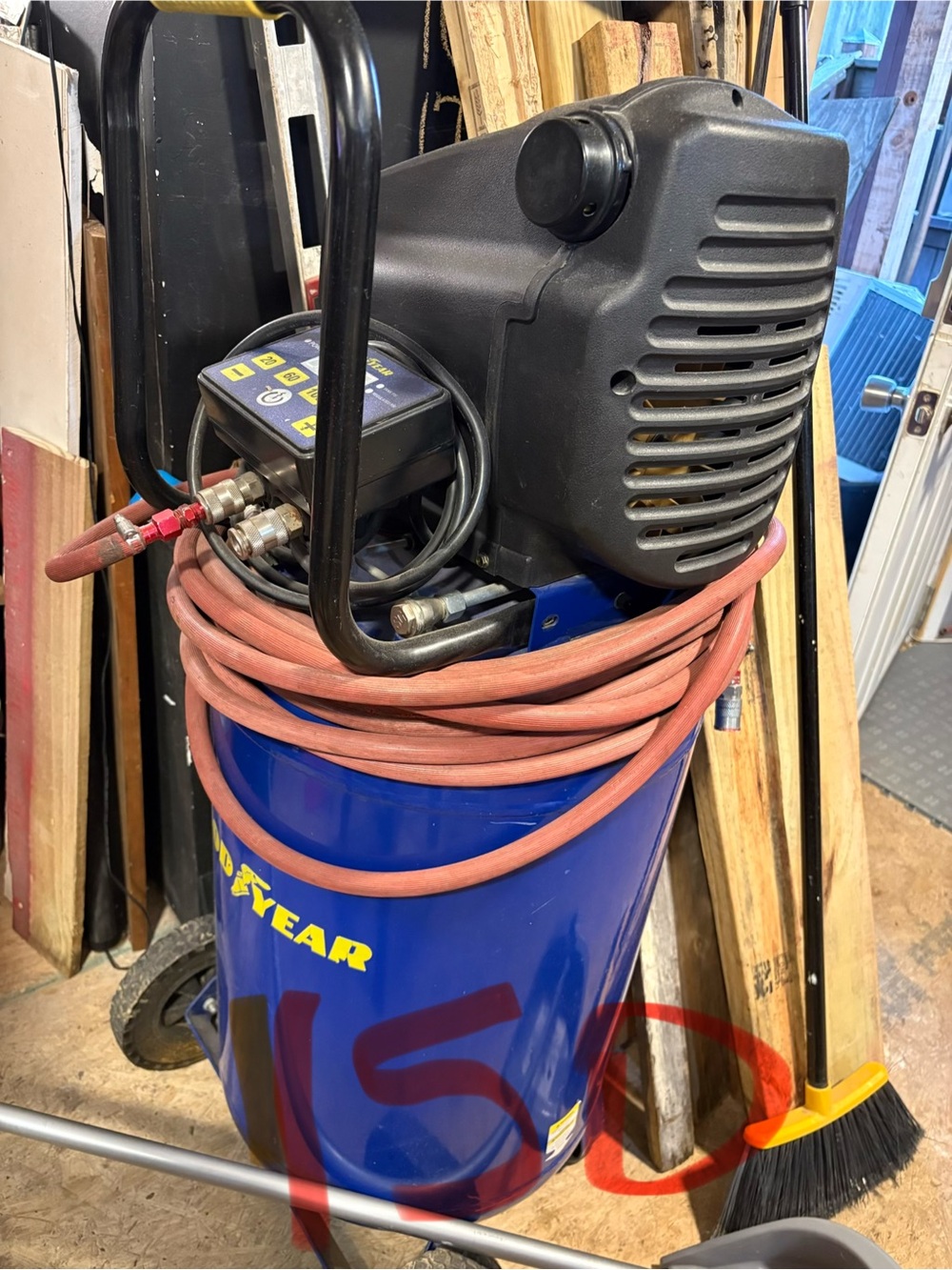 Blue Portable Air Compressor with Black Motor and Red Hose
